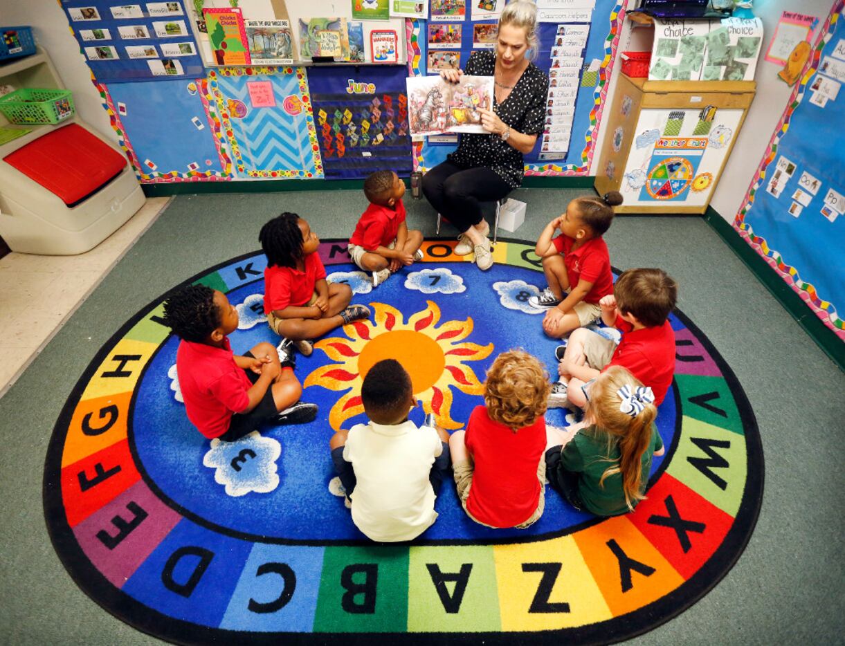 Three-year-olds at CP Preparatory School in Mesquite listen to instructor Erin Jones as she...