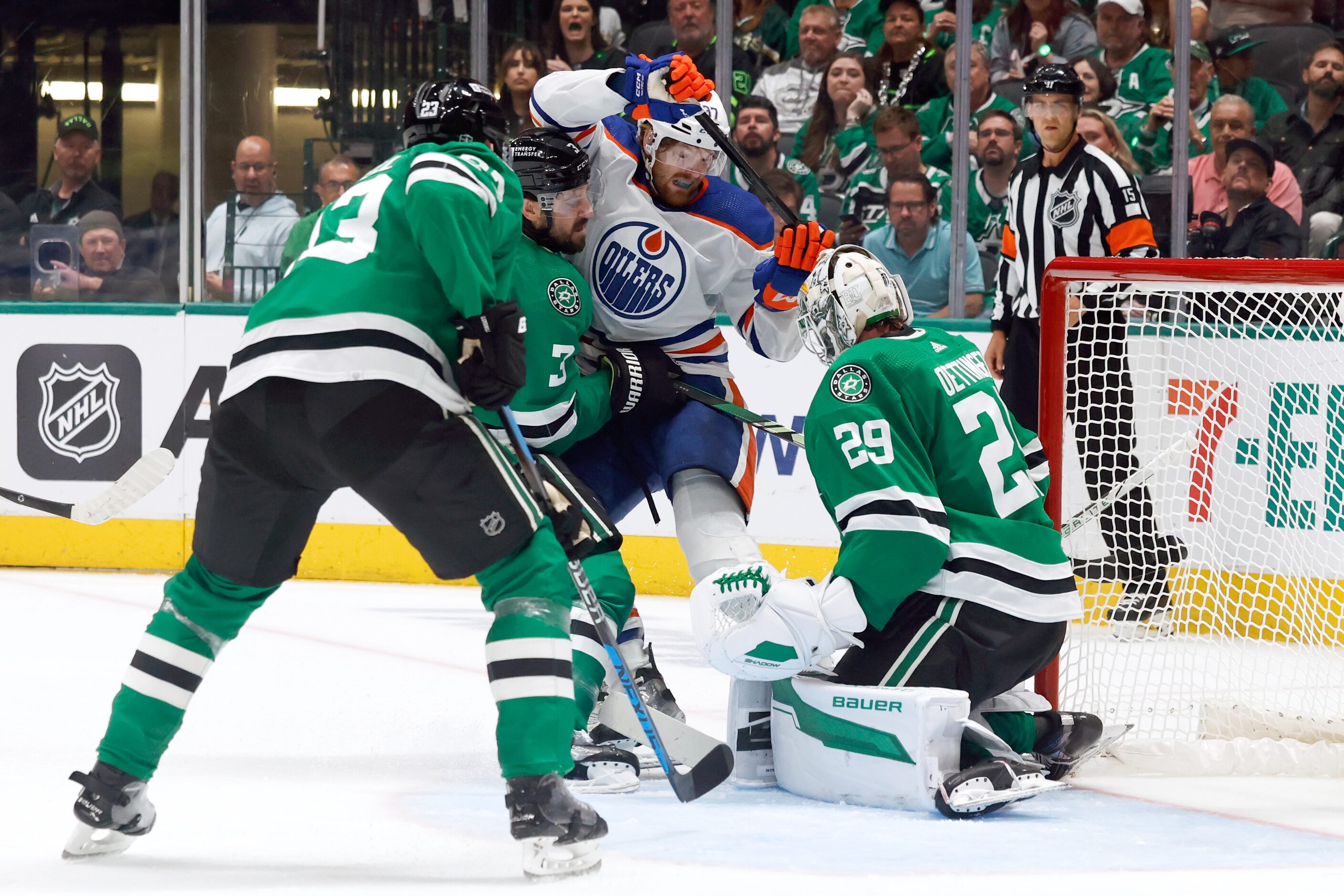 Dallas Stars defenseman Chris Tanev (3) pushes Edmonton Oilers left wing Warren Foegele (37)...