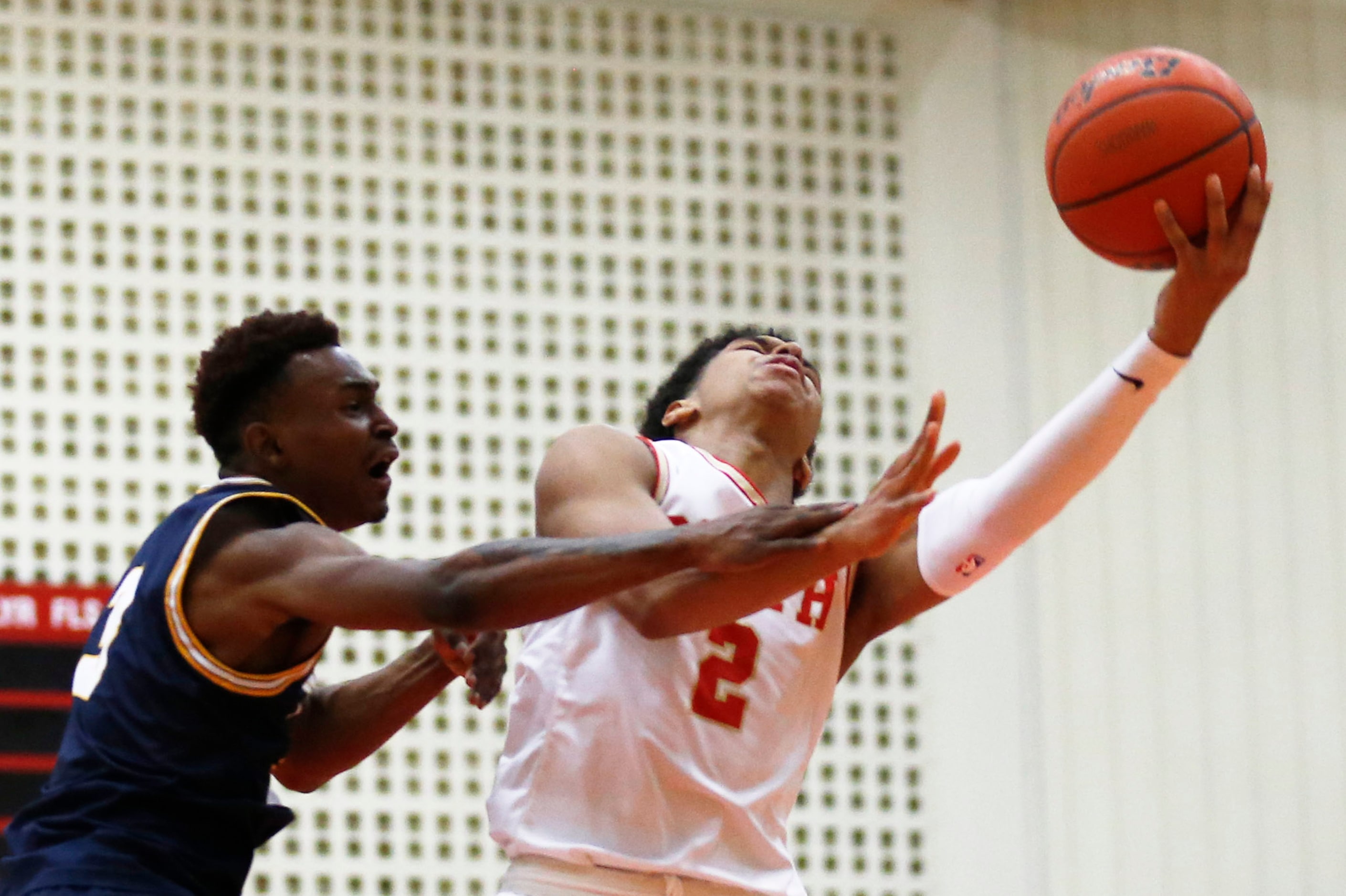 South Grand Prairie's Jordan Roberts (2) is fouled by  Arlington Lamar's Dorian Manigo (3)...