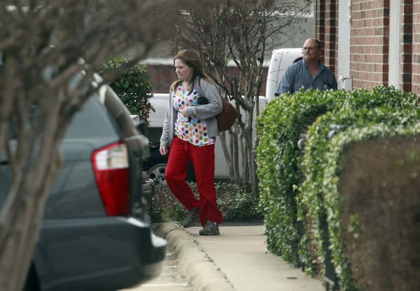 Employees leave the offices of Medistat Group Associates in DeSoto in February 2012 after...