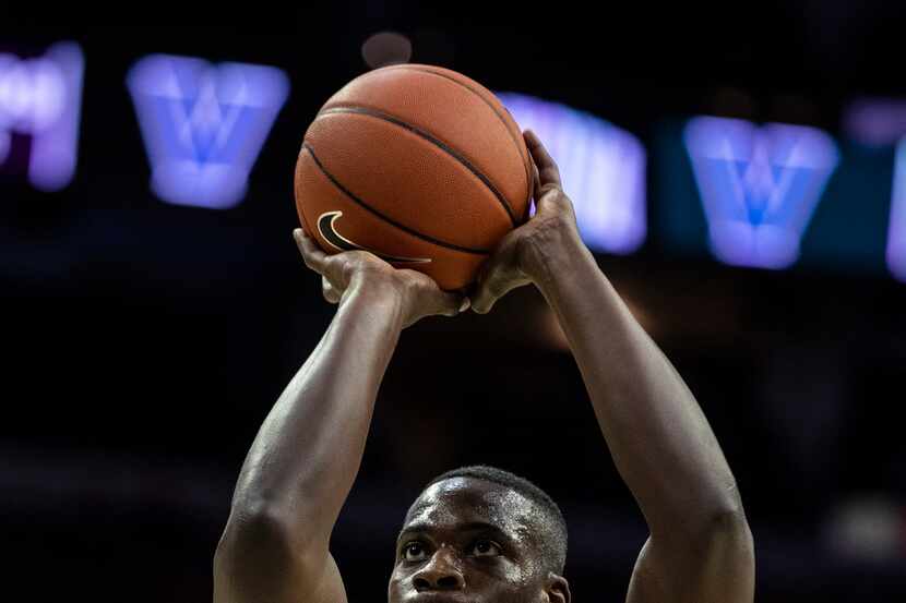 Quinnipiac's Kevin Marfo shoots the ball during the second half of an NCAA college...