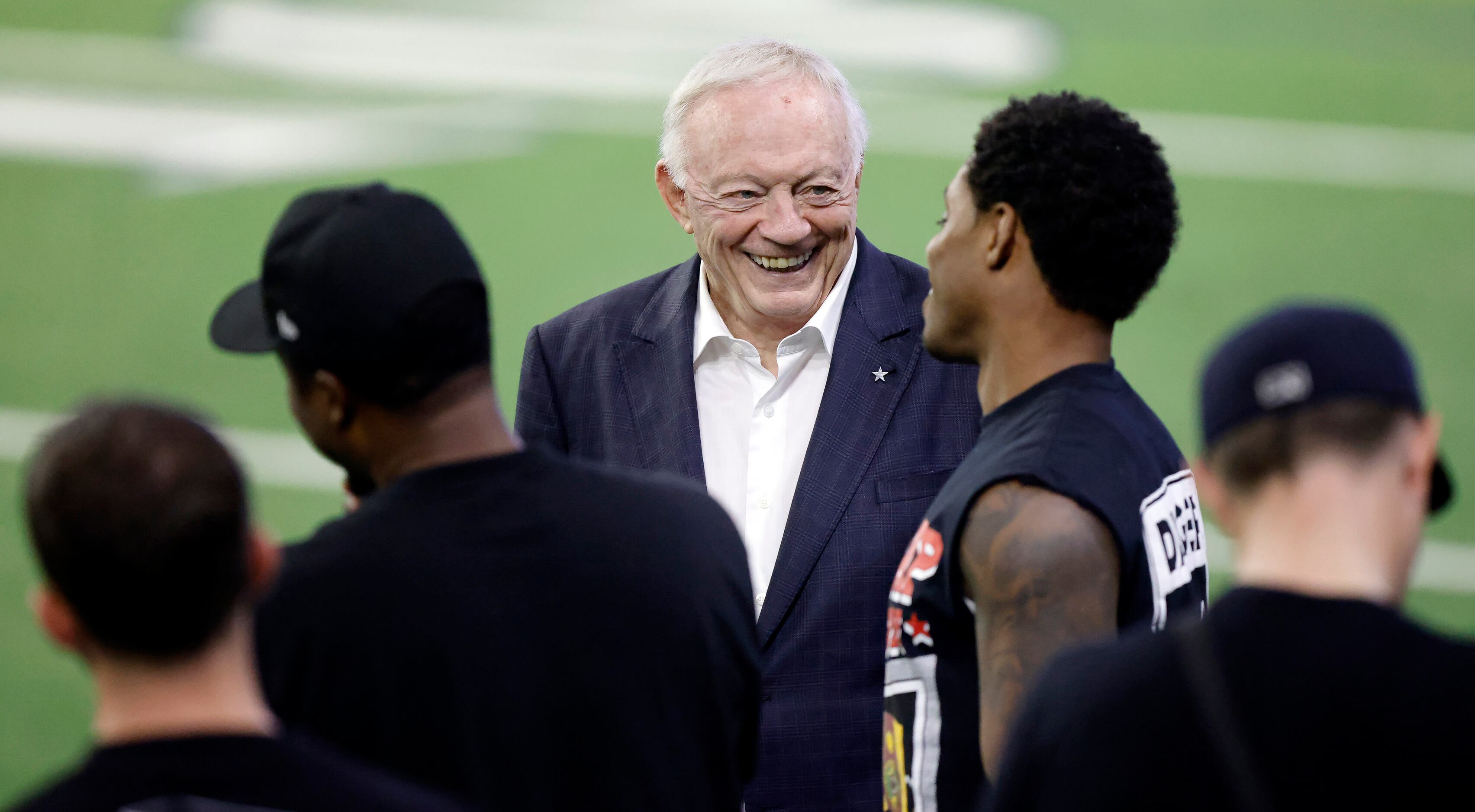 Dallas Cowboys owner Jerry Jones (center) visits with professional boxer Errol Spence Jr. of...