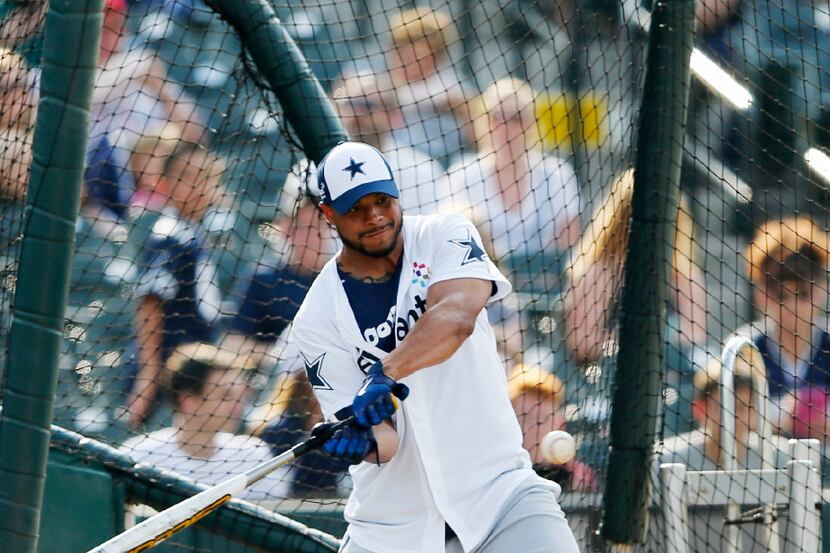 Dallas Cowboys quarterback Dak Prescott (4) swings at the ball during the sixth annual...