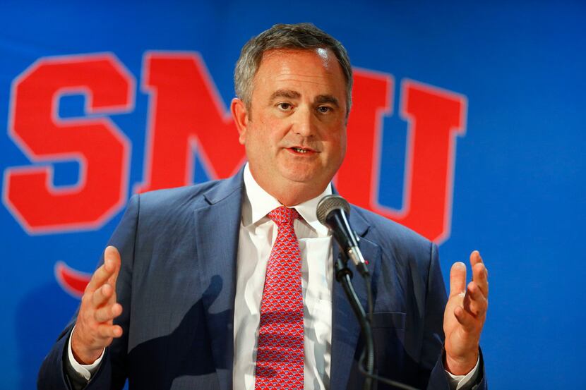 FILE - SMU football coach Sonny Dykes addresses the crowd and media during his introductory...