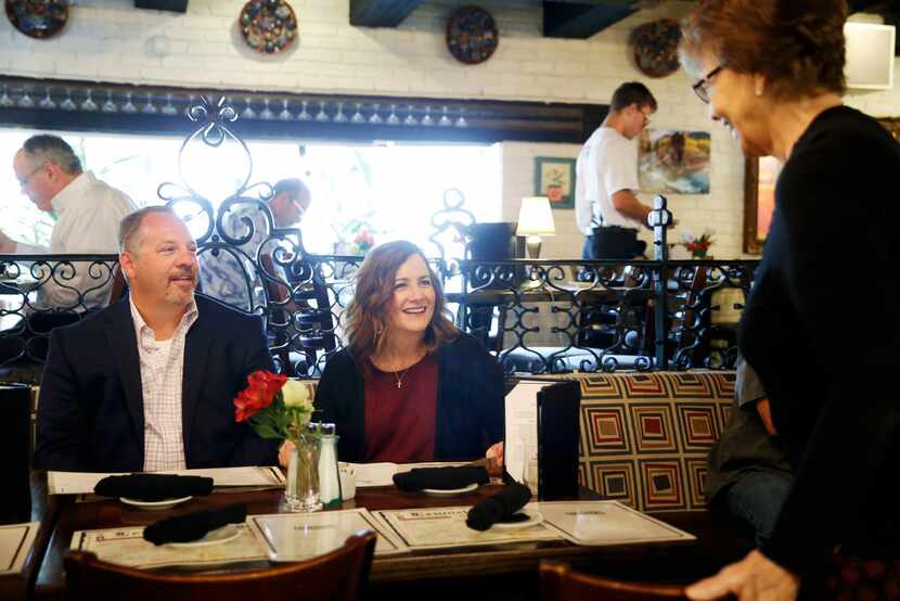 Brent and Amy Hardesty smile as her parents, Patricia and Conrad Herman, arrive for lunch at...