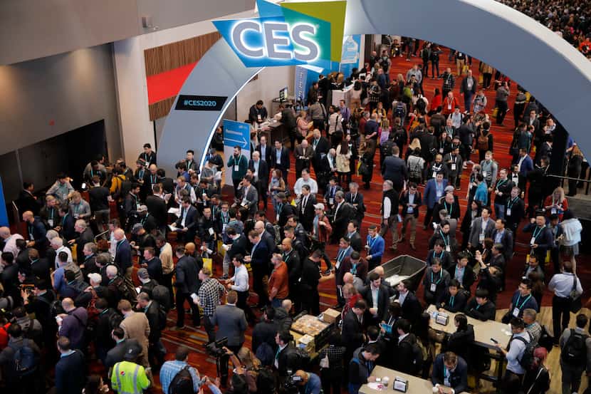 Crowds enter the convention center at the CES tech show in Las Vegas. (AP Photo/John Locher)