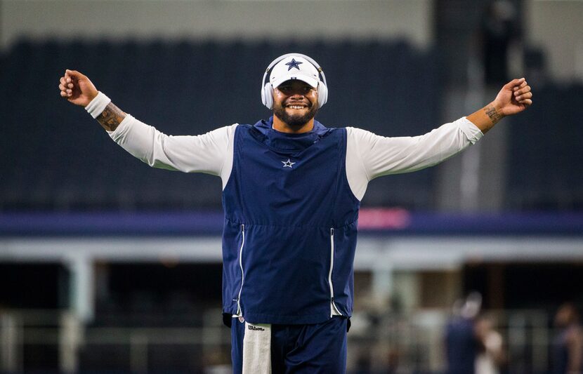 Dallas Cowboys quarterback Dak Prescott (4) warms up before an NFL game between the Dallas...