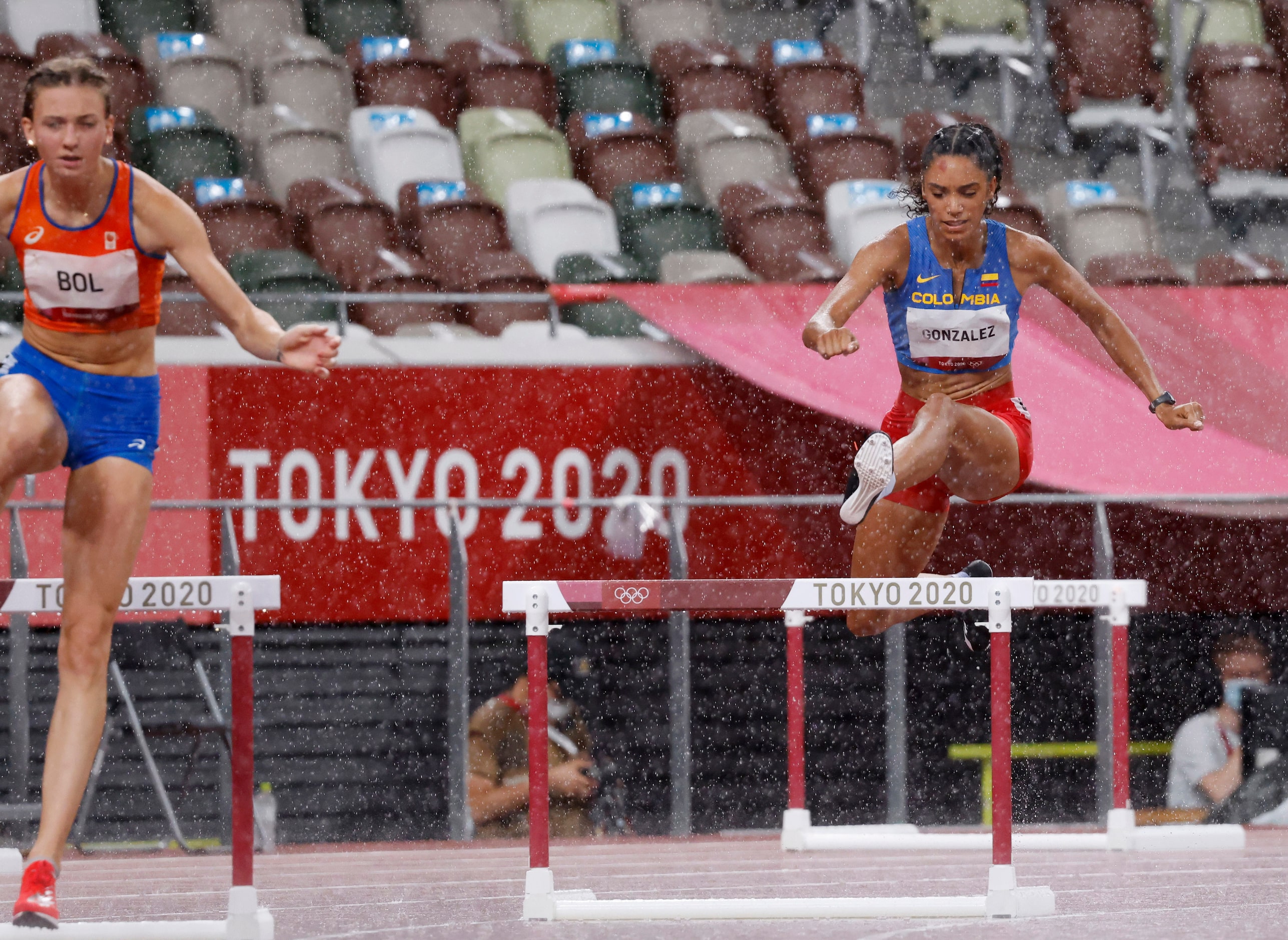 Columbia’s Melissa Gonzalez competes in the women’s 400 meter hurdles semifinal during the...