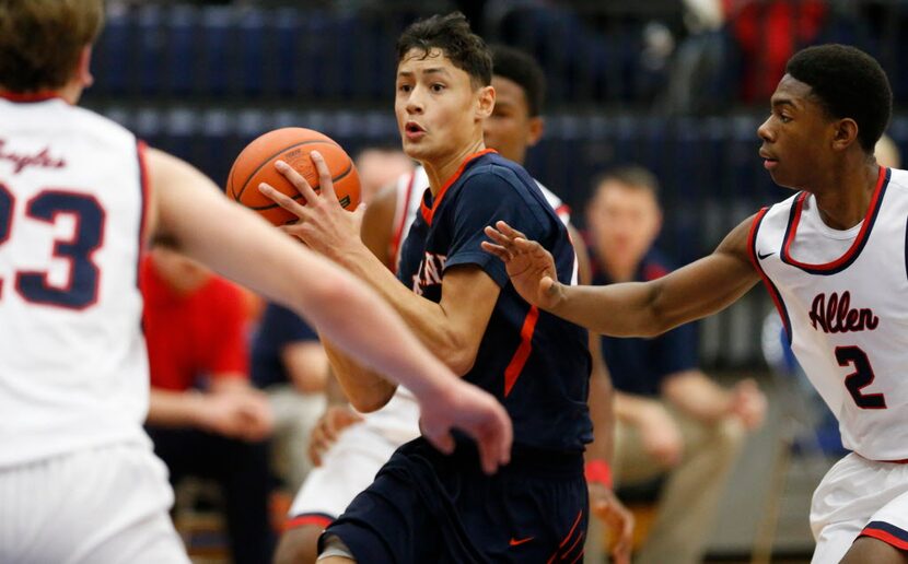 Wakeland gaurd Favante McCoy drives past Allen gaurd Brenton Mills (2) during the second...