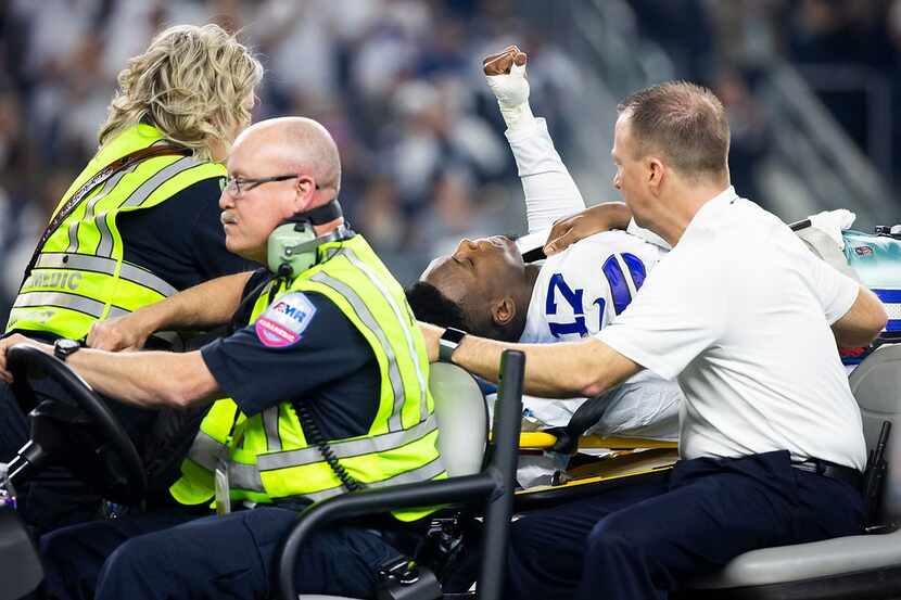 Dallas Cowboys wide receiver Allen Hurns (17) leaves the field on a stretcher after being...
