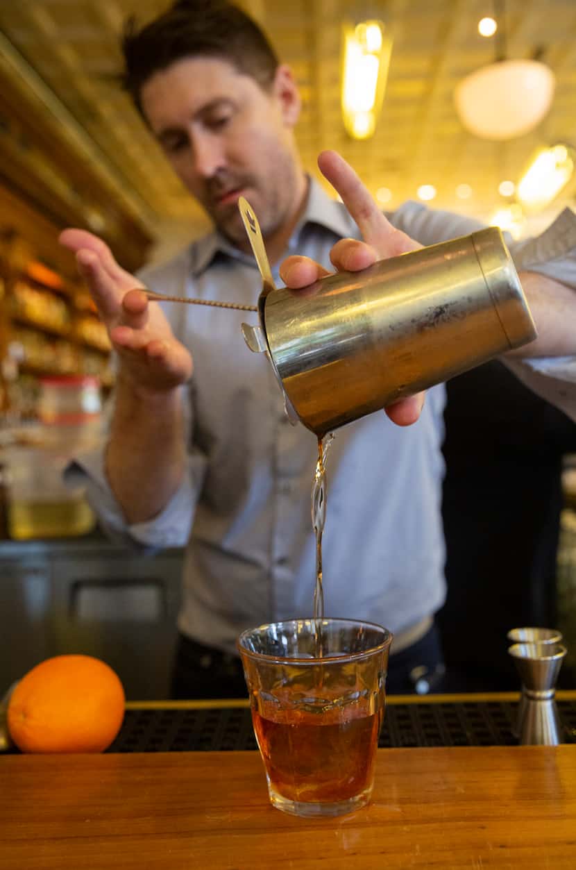 Abraham Bedell pours an old-fashioned made with the Maker's Mark Private Select single...