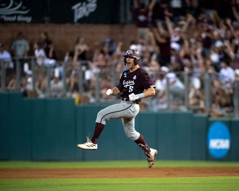 Texas A&M outfielder Hayden Schott (5) celebrates a solo home run against Louisiana during...