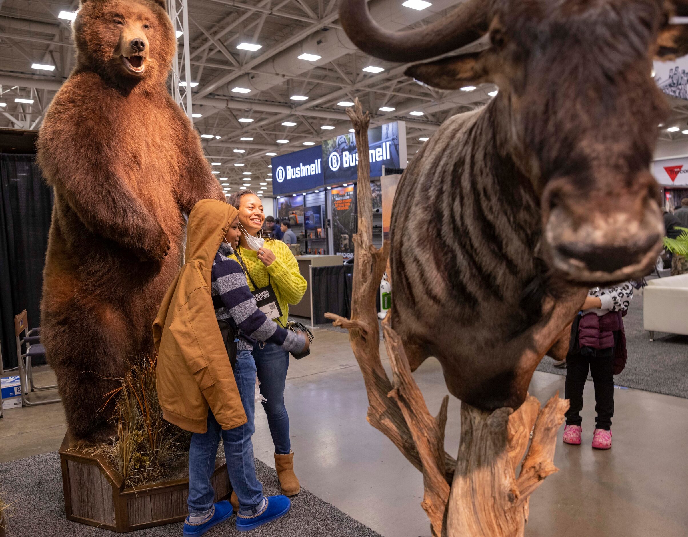 Danny Hudson (left) and mom Porscha Hudson pose for a photo at the Legends Taxidermy booth...