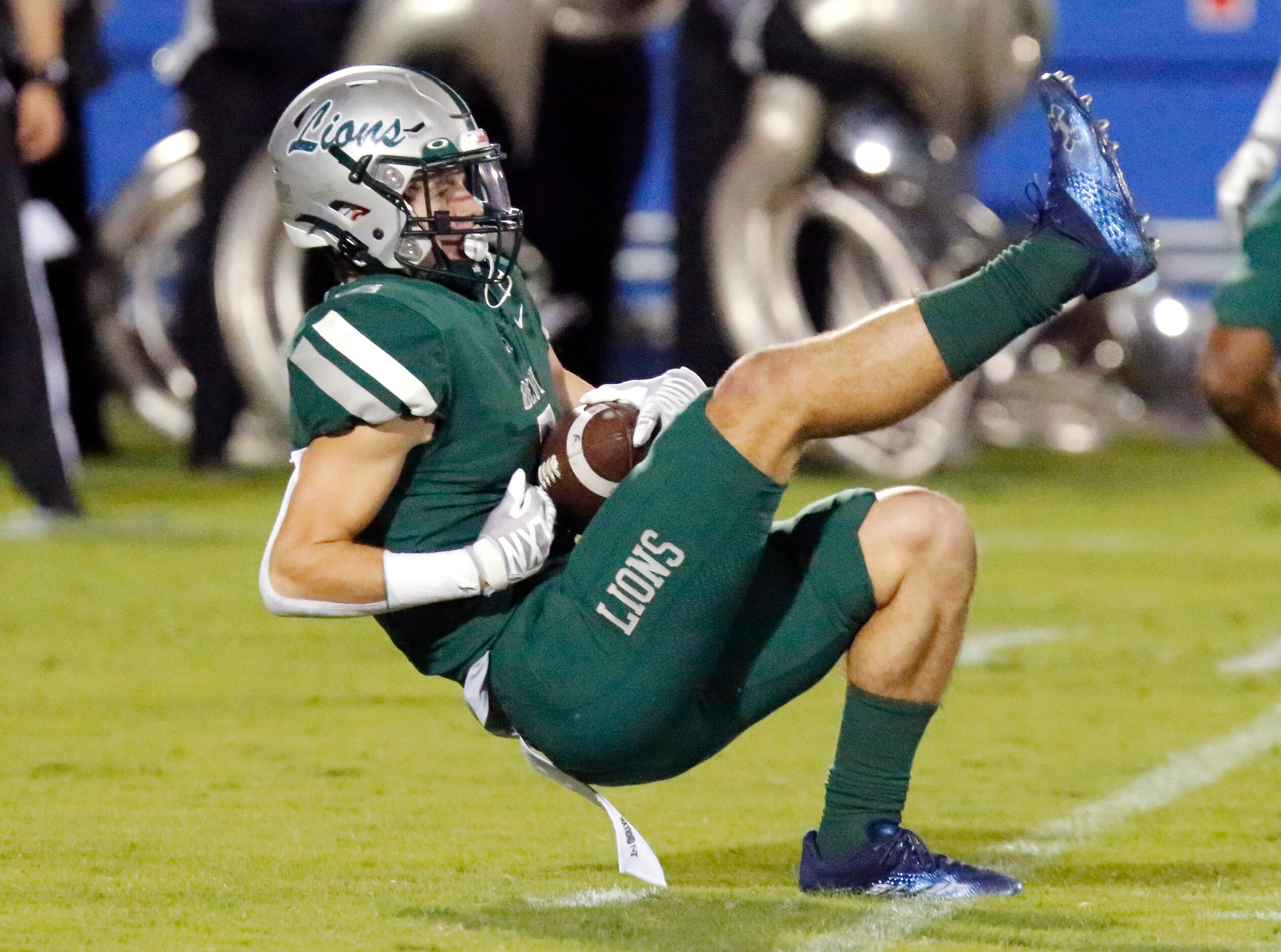 Reedy High School free safety Will Rubalcava (4) falls to the ground with an interception...