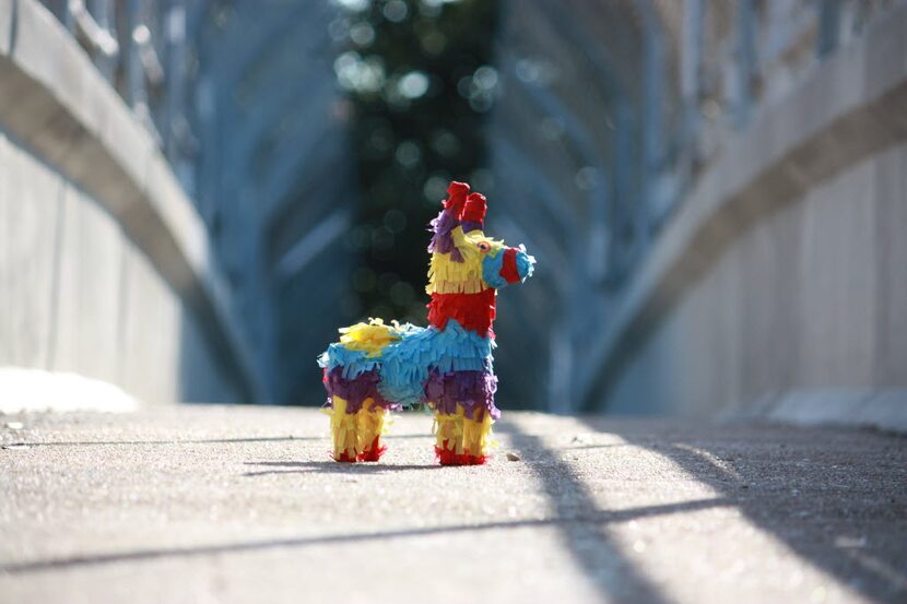 A lone Piñatagram sits on a bridge. 