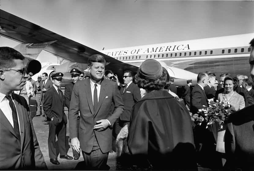 Secret Service agent Paul Landis (far left) stands near President John F. Kennedy and first...
