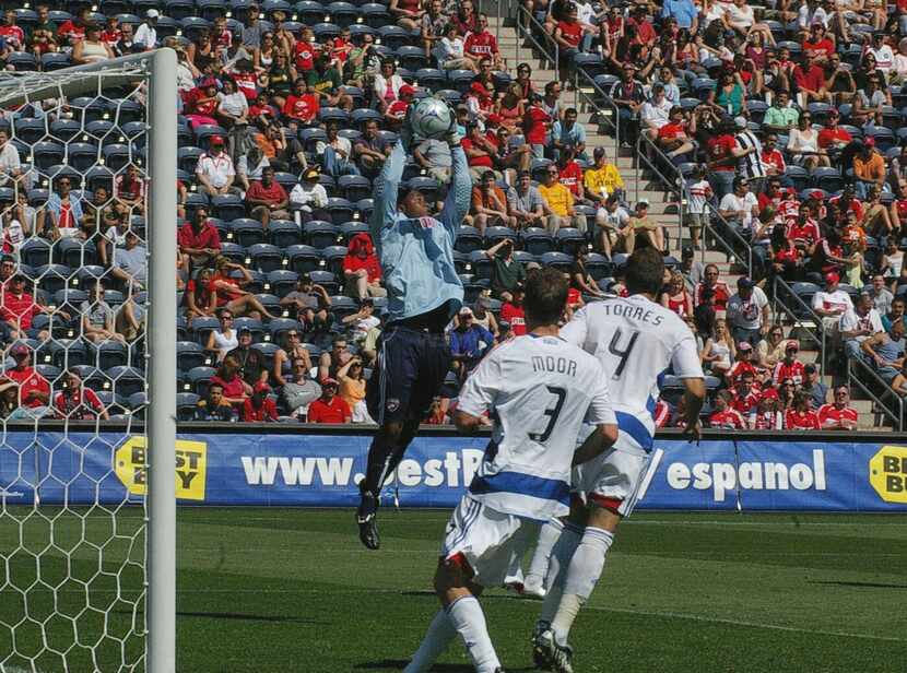 Ray Burse goes up to grab the ball against the Chicago Fire at Toyota Park. (5-31-09)