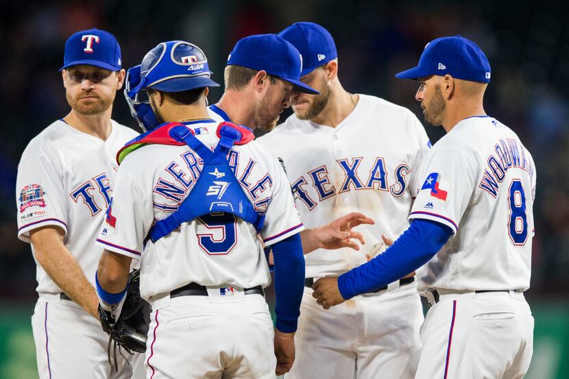 Texas Rangers relief pitcher Jeffrey Springs (54) is pulled off the mound by manager Chris...