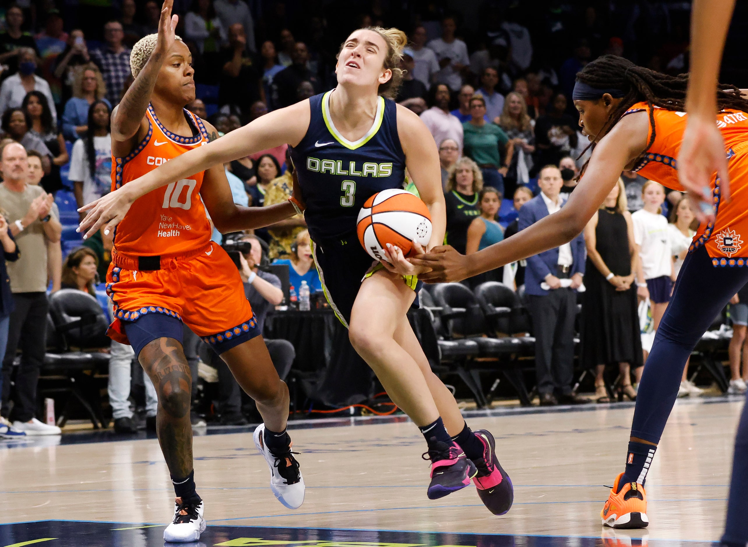 Dallas Wings guard Marina Mabrey (3) drives the lane past Connecticut Sun guard Courtney...