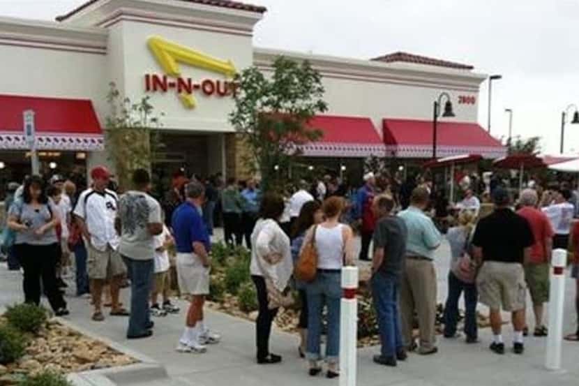 A crowd gathered outside the In-N-Out Burger in Frisco for its opening on May 11, 2011.