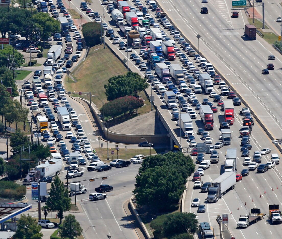 Motorists try to exit to southbound Highway 75 at the Midpark exit, as the access road...