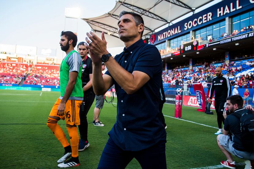 FC Dallas coach Luchi Gonzalez enters the field before an MLS game between FC Dallas and...