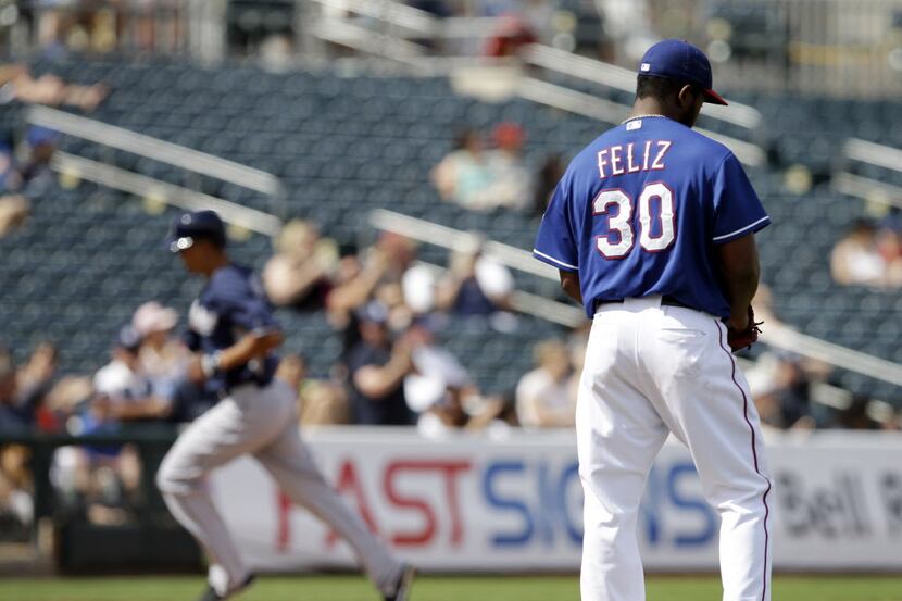 Texas Rangers' Neftali Feliz gets a new baseball after giving up a home run to San Diego...