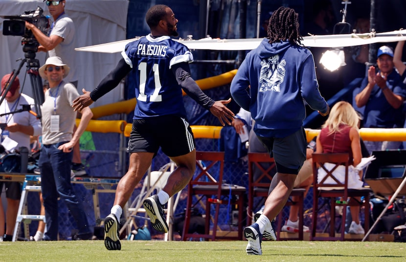 Dallas Cowboys linebacker Micah Parsons (11) and cornerback Trevon Diggs (7) raced each...