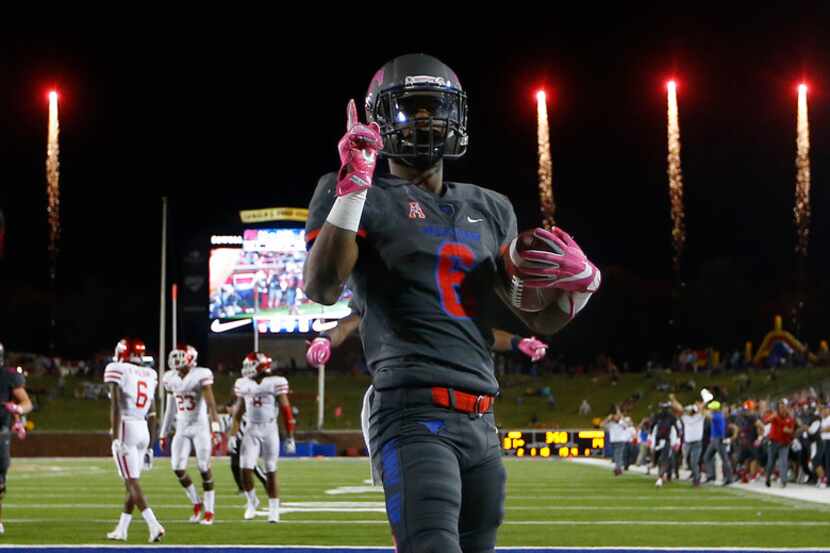 FILE - Southern Methodist Mustangs running back Braeden West (6) scores the final touchdown...