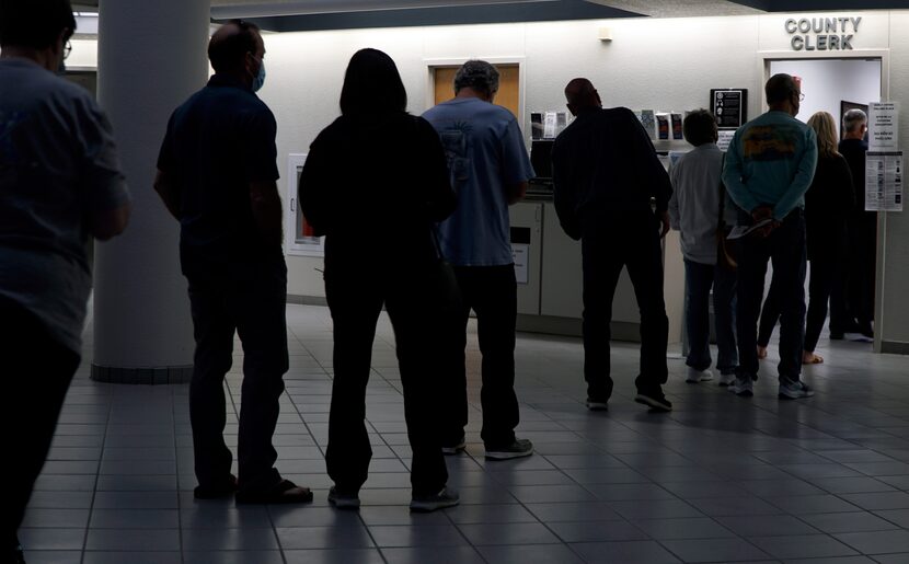 Voters waited in line at the Tarrant County sub-courthouse in Mansfield on Tuesday, the last...