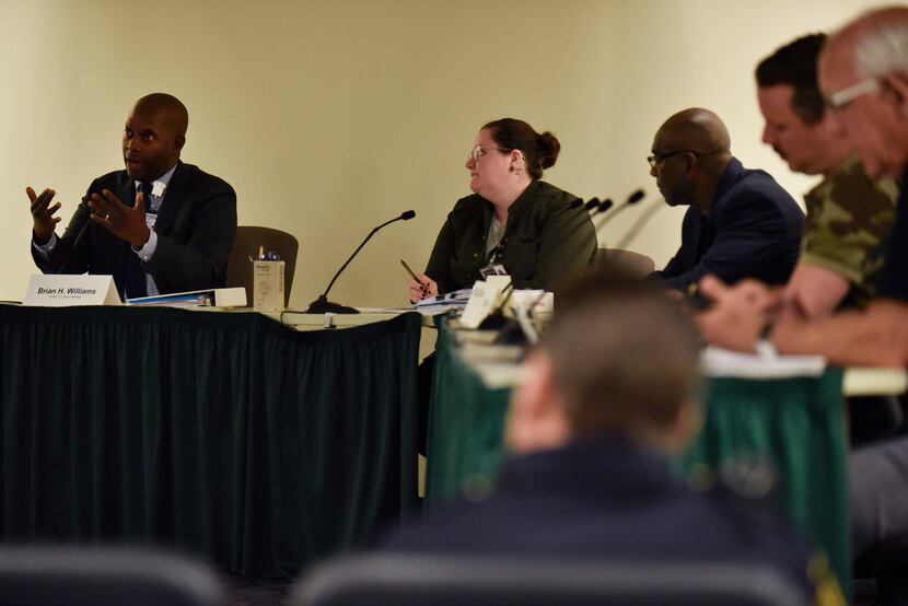 Brian Williams, left, chair of the Dallas Citizens Police Review Board, conducts a meeting...