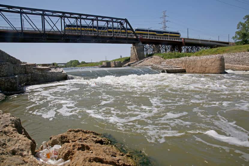 Water rushed over the second stage of the Standing Wave feature at the Santa Fe Trestle on...