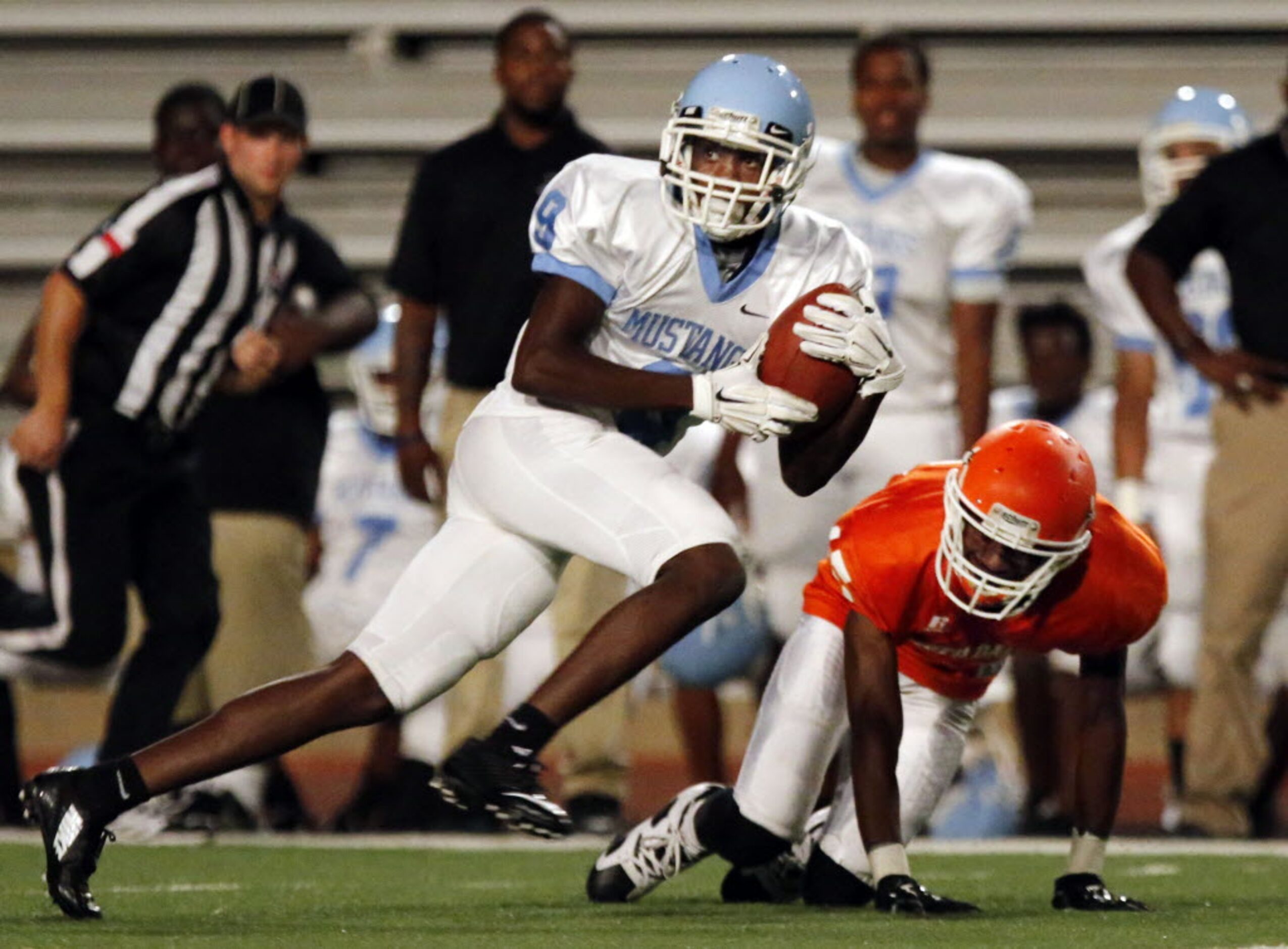 (TXHSFB) Roosevelt High WR Donovan Davidson (9) grabs a pass and heads to the end zone, as...