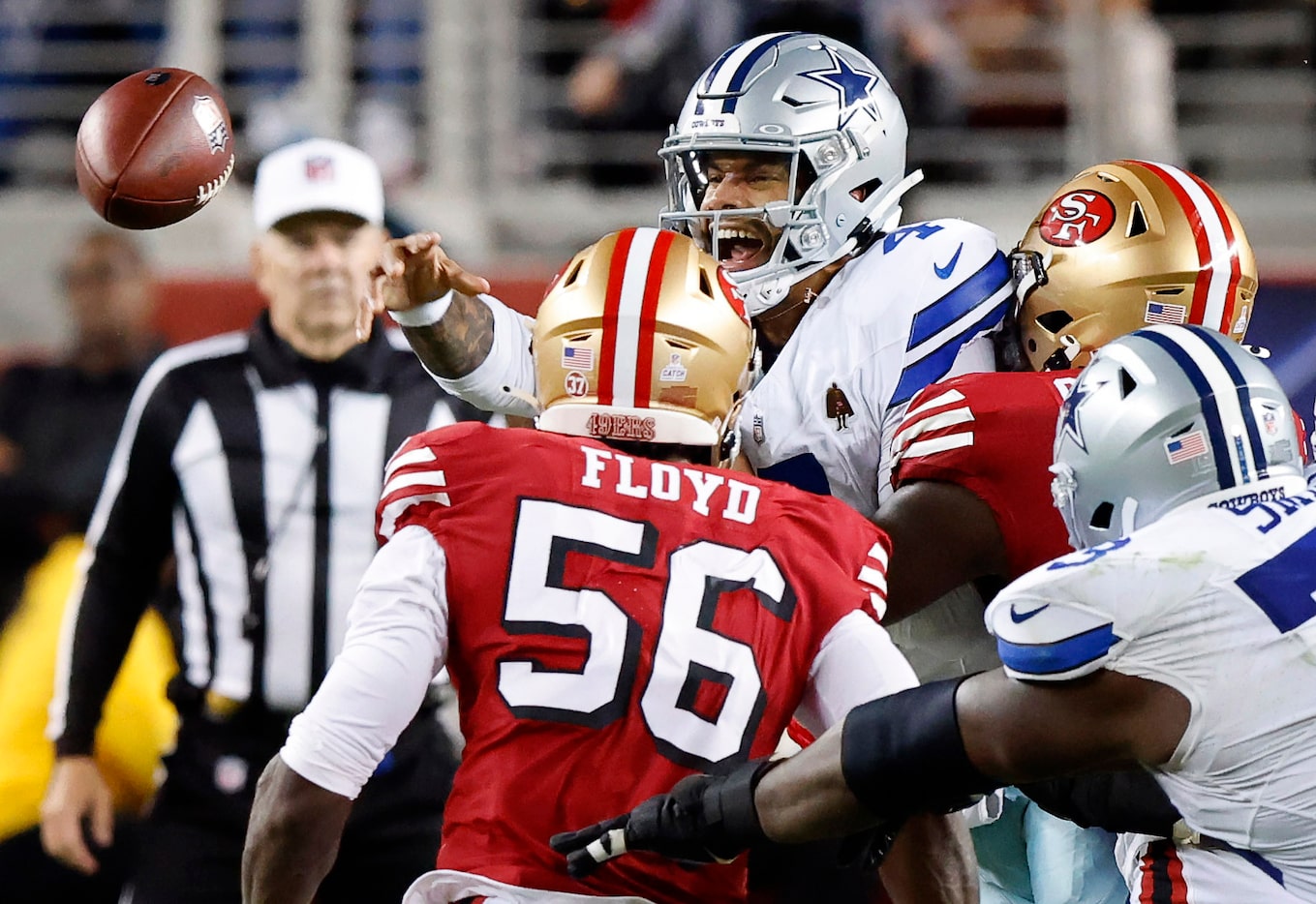 Dallas Cowboys quarterback Dak Prescott (4) loses control of a pass during the second...