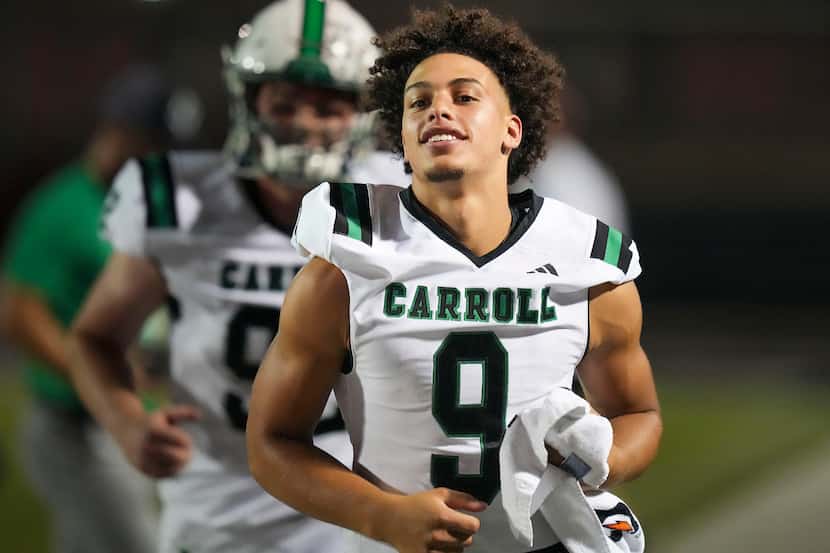 Southlake Carroll running back Riley Wormley on the sidelines with teammates during the...