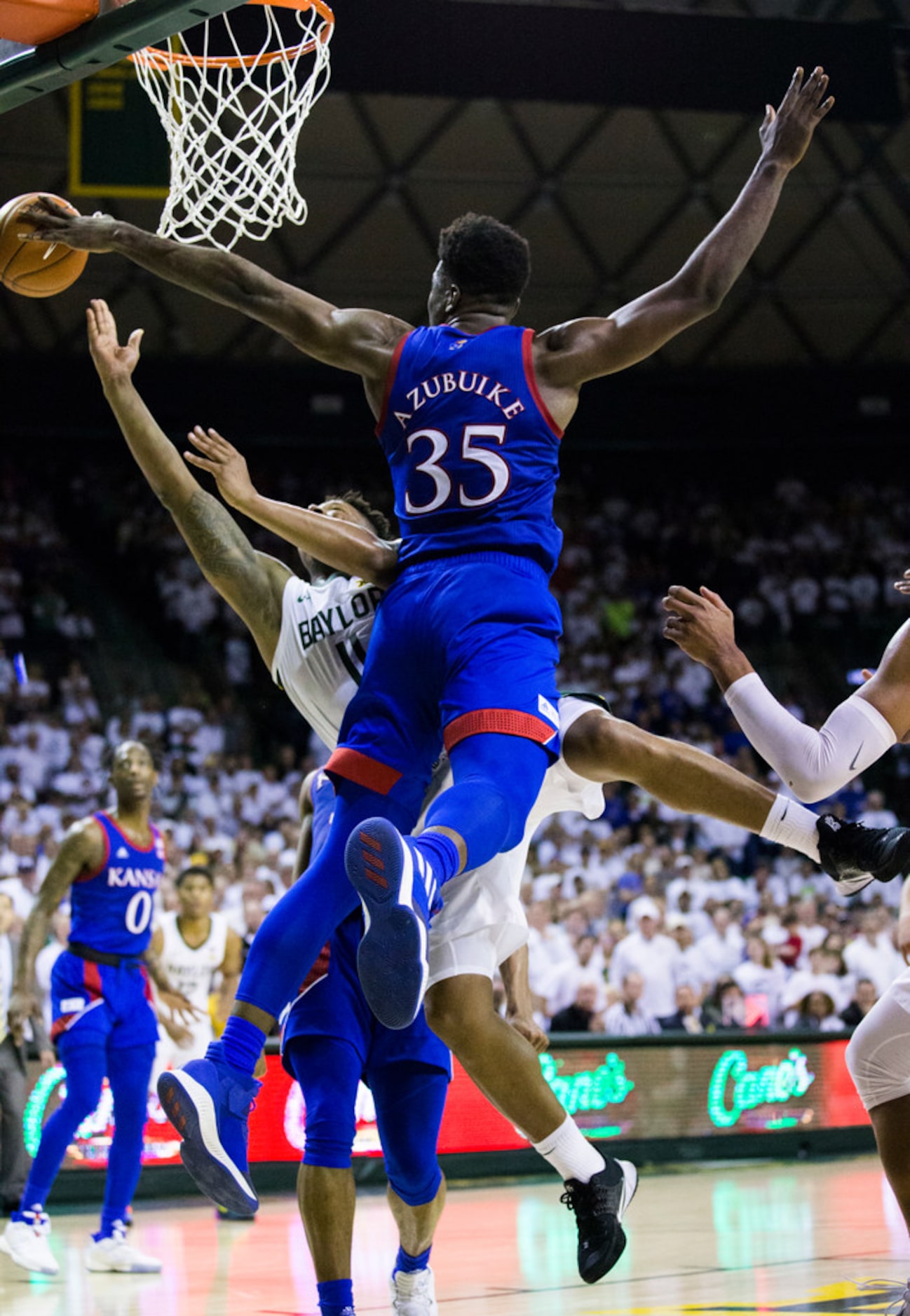 Baylor Bears guard Mark Vital (11) is fouled by Kansas Jayhawks center Udoka Azubuike (35)...