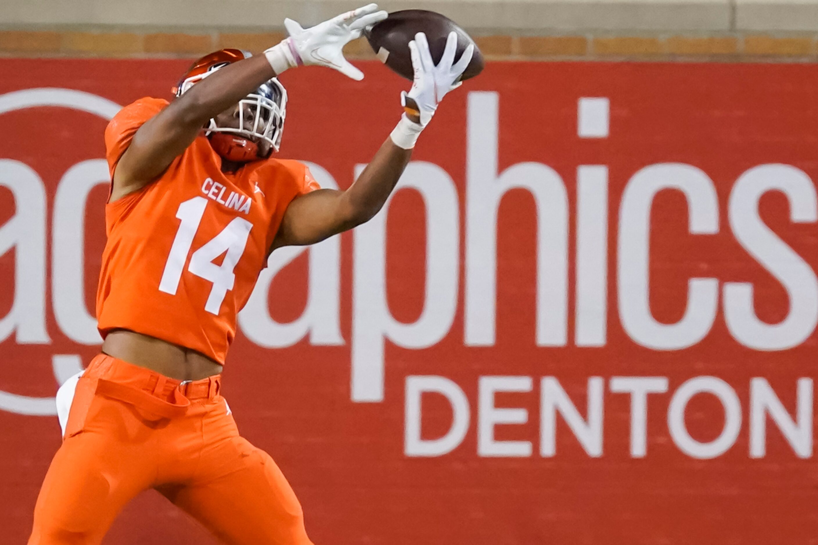 Celina running back  Trae Hollins (14) catches a touchdown pass during the second quarter of...