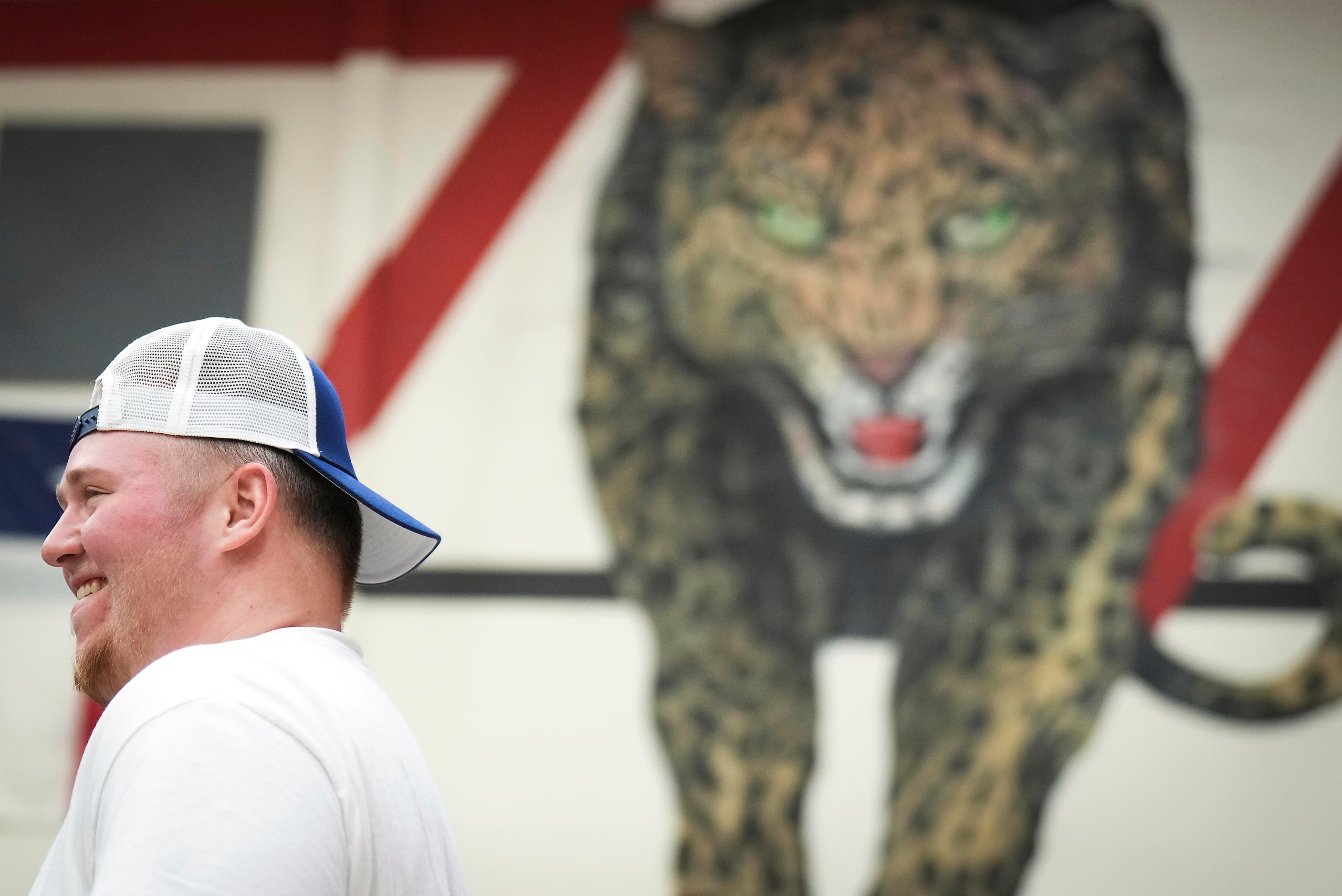 Lovejoy all-state offensive lineman Sam Reynolds smiles while posing for a photo during a...