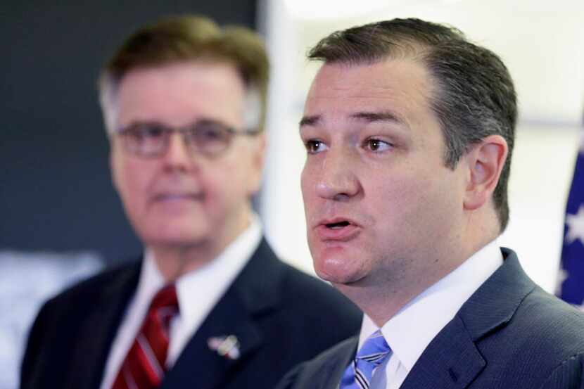 
Texas Lt. Gov. Dan Patrick listens at left as Sen. Ted Cruz, R-Texas, speaks at a news...