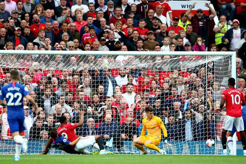 Manchester United's Anthony Martial, center left, scores his sides second goal past...