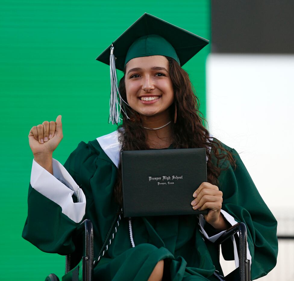 Prosper High School softball player Lexie Bell poses for a portrait after she received her...