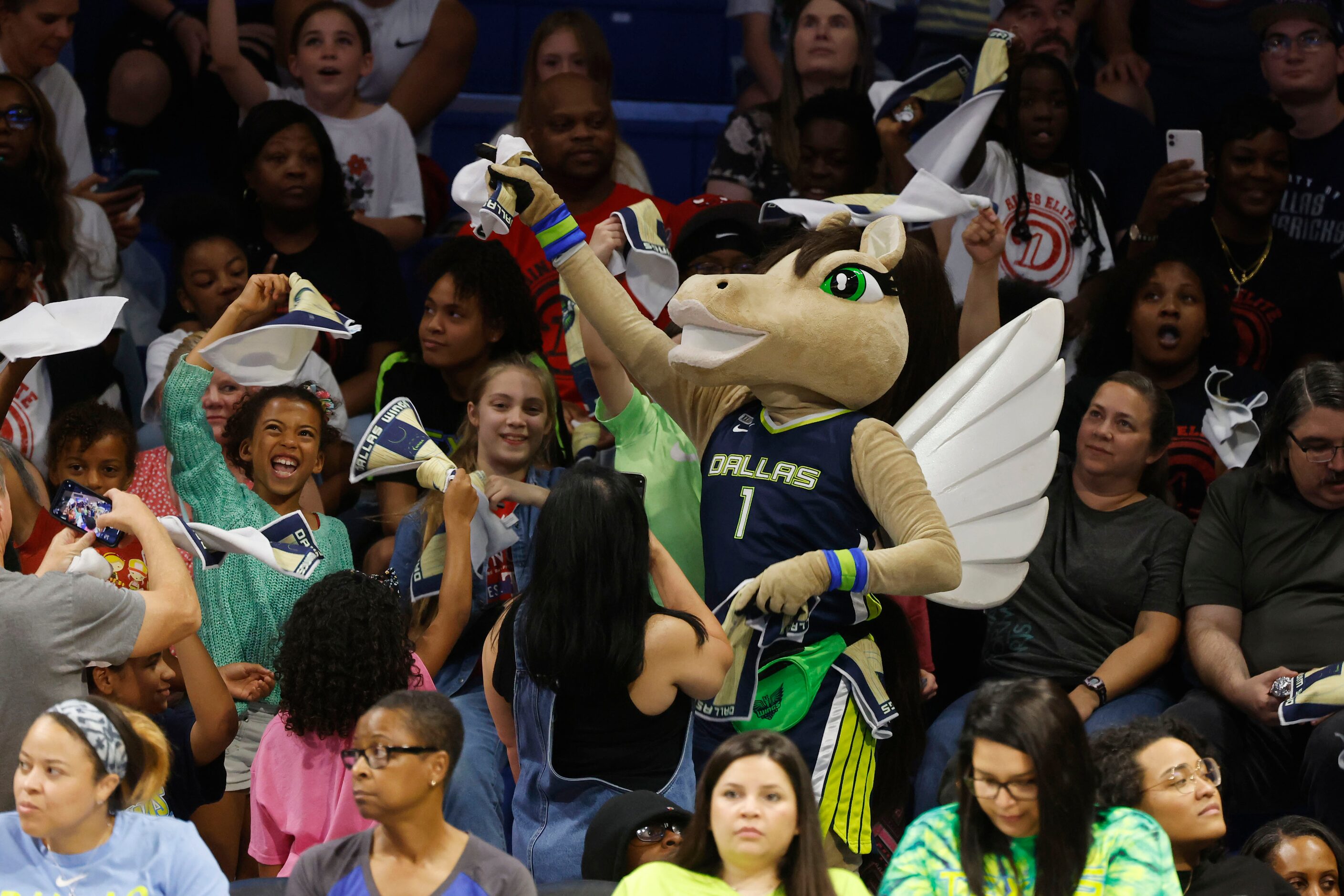 Dallas Wings mascot “Lightning” gets the crowd going as they play the Atlanta Dream during...