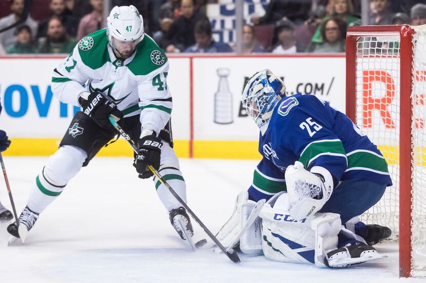 Dallas Stars' Alexander Radulov (47), of Russia, is stopped by Vancouver Canucks goalie...