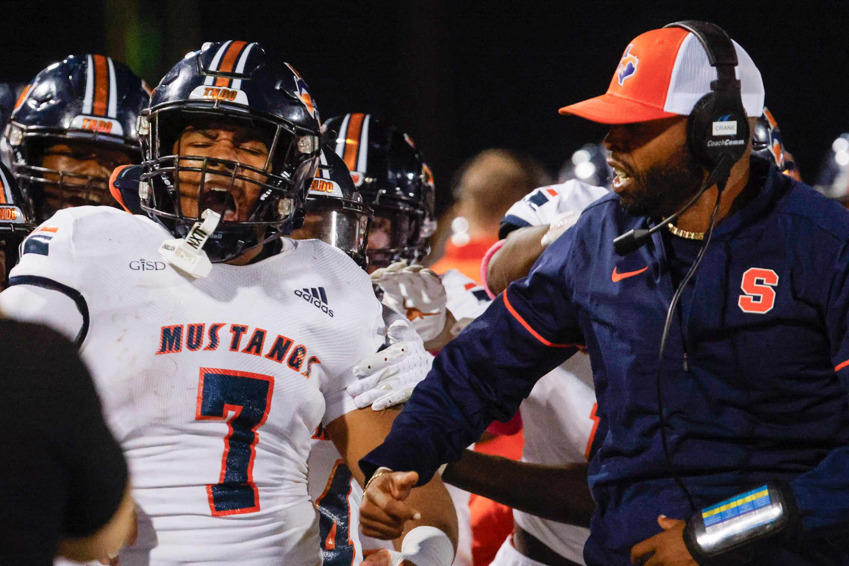 Sachse high school’s Vashon Brunswick (7) cheers with his teammates after intercepting a...