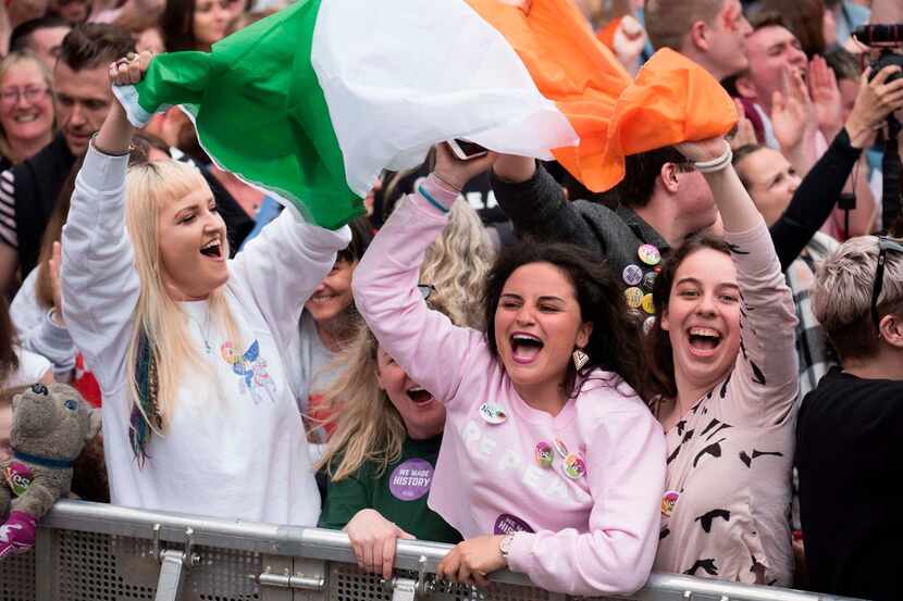 People celebrate the official result of the Irish abortion referendum at Dublin Castle in...