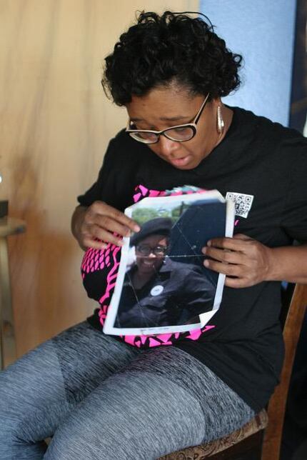 Olinka Green shows an photo of herself in her New Black Panther Party uniform from her early...