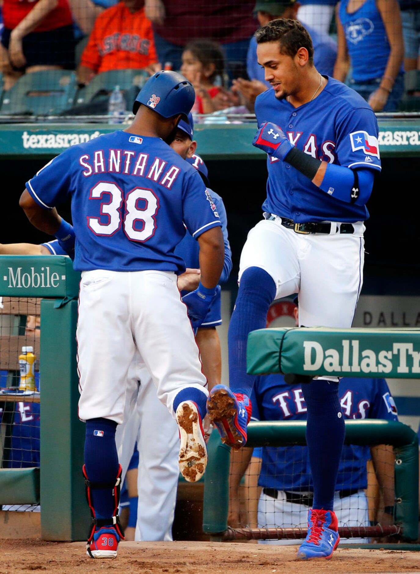 Texas Rangers Danny Santana (38) is congratulated by Ronald Guzman after hitting a solo home...