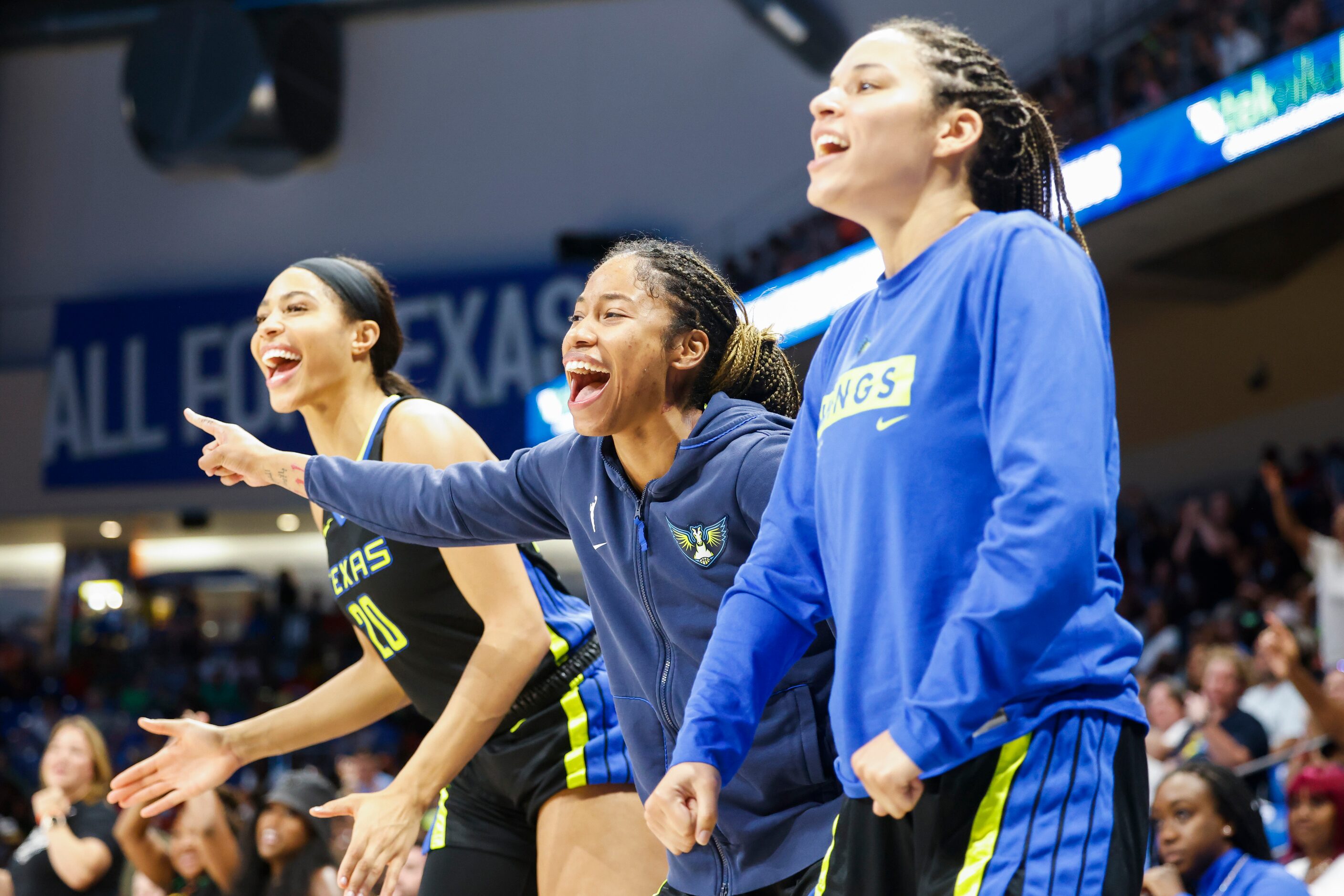 Dallas Wings bench players cheers during the second half of a WNBA basketball game against...