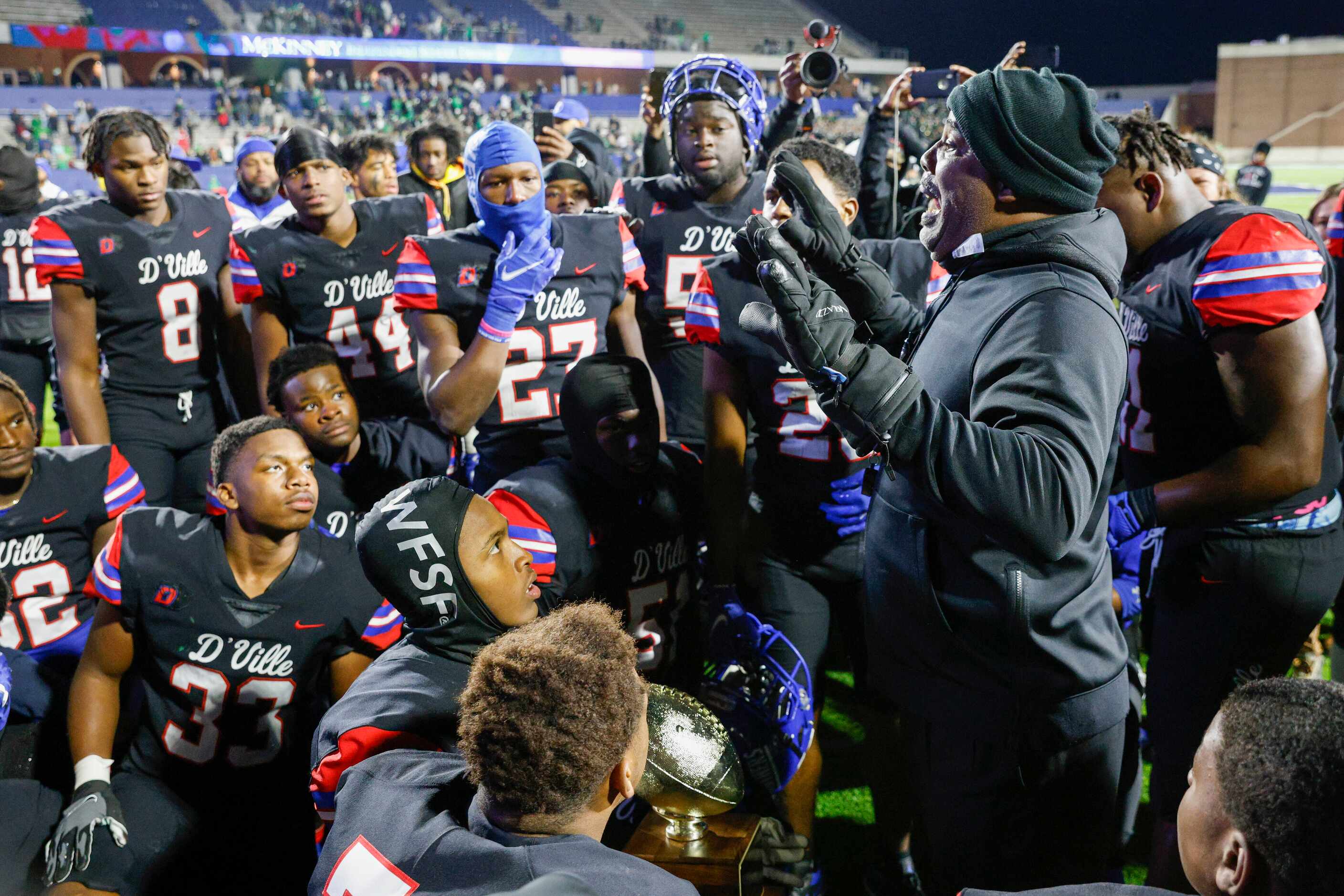 Duncanville head coach Reginald Samples speaks with players after defeating Southlake...