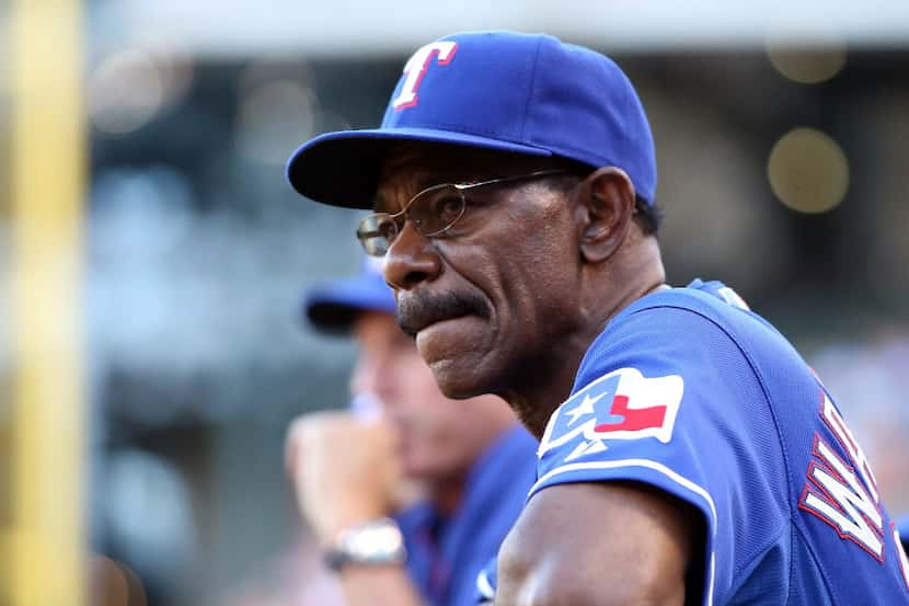 ARLINGTON, TX - JUNE 9:  Manager Ron Washington #38 of the Texas Rangers looks on from the...